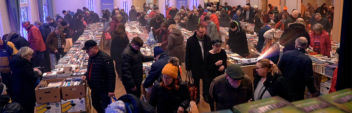 Event guests collecting free books in Free Book Day 2019